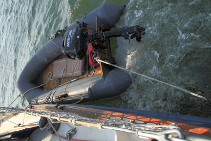 Dingy and outboard used as engine.